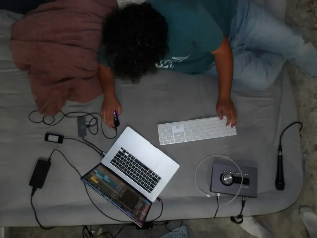 How To Take Care Of Your Mental Health As A New Mom: The Ultimate Guide 4 person on a bed using multiple forms of technology
